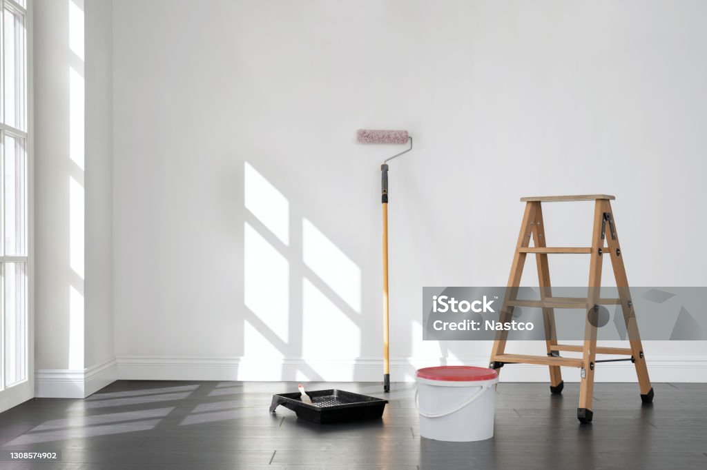 Painting the room, empty apartment ready for renovation, with copy space